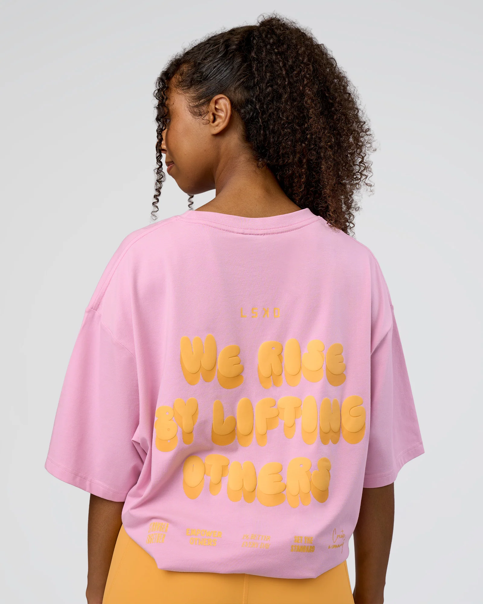 14536-together-we-rise-flxcotton-oversized-tee-bubblegum-warm-apricot-4.webp Together We Rise FLXCotton Oversized Tee - Bubblegum-Warm Apricot