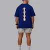 Unisex Strike Through FLXCotton Tee Oversize - Midnight Blue-Vibrant Orange
