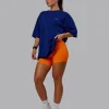 Unisex Strike Through FLXCotton Tee Oversize - Midnight Blue-Vibrant Orange