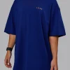Unisex Strike Through FLXCotton Tee Oversize - Midnight Blue-Vibrant Orange