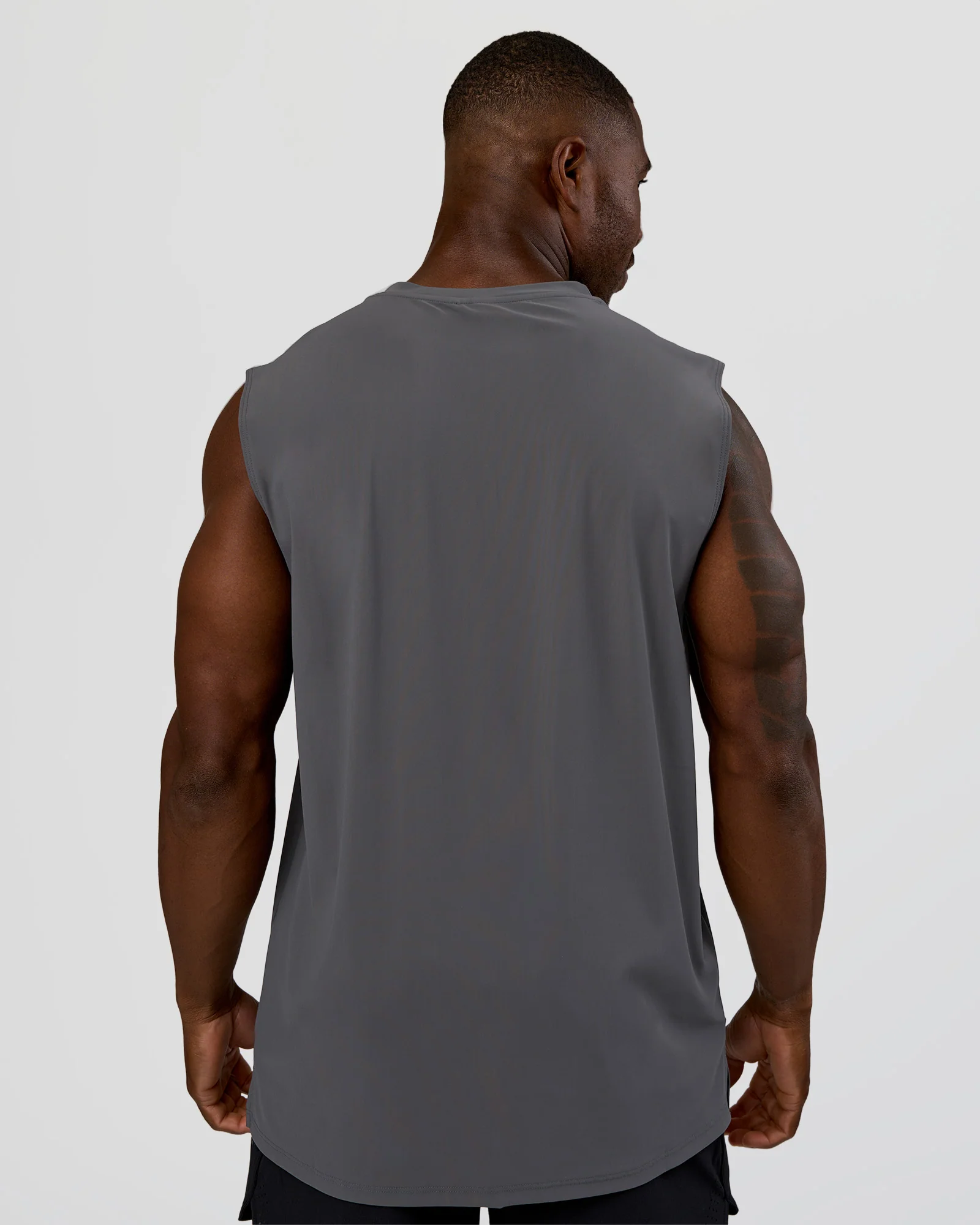 20944-cadence-micromotion-muscle-tank-dark-storm-3.webp Cadence MicroMotion Muscle Tank - Dark Storm