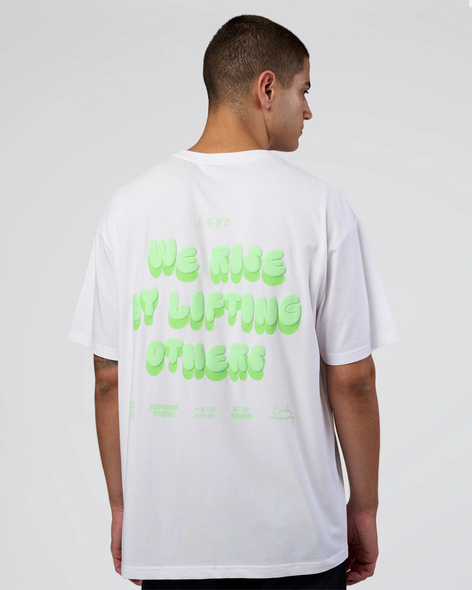 5724-together-we-rise-flxcotton-oversized-tee-white-solar-lime-1.webp Together We Rise FLXCotton Oversized Tee - White-Solar Lime