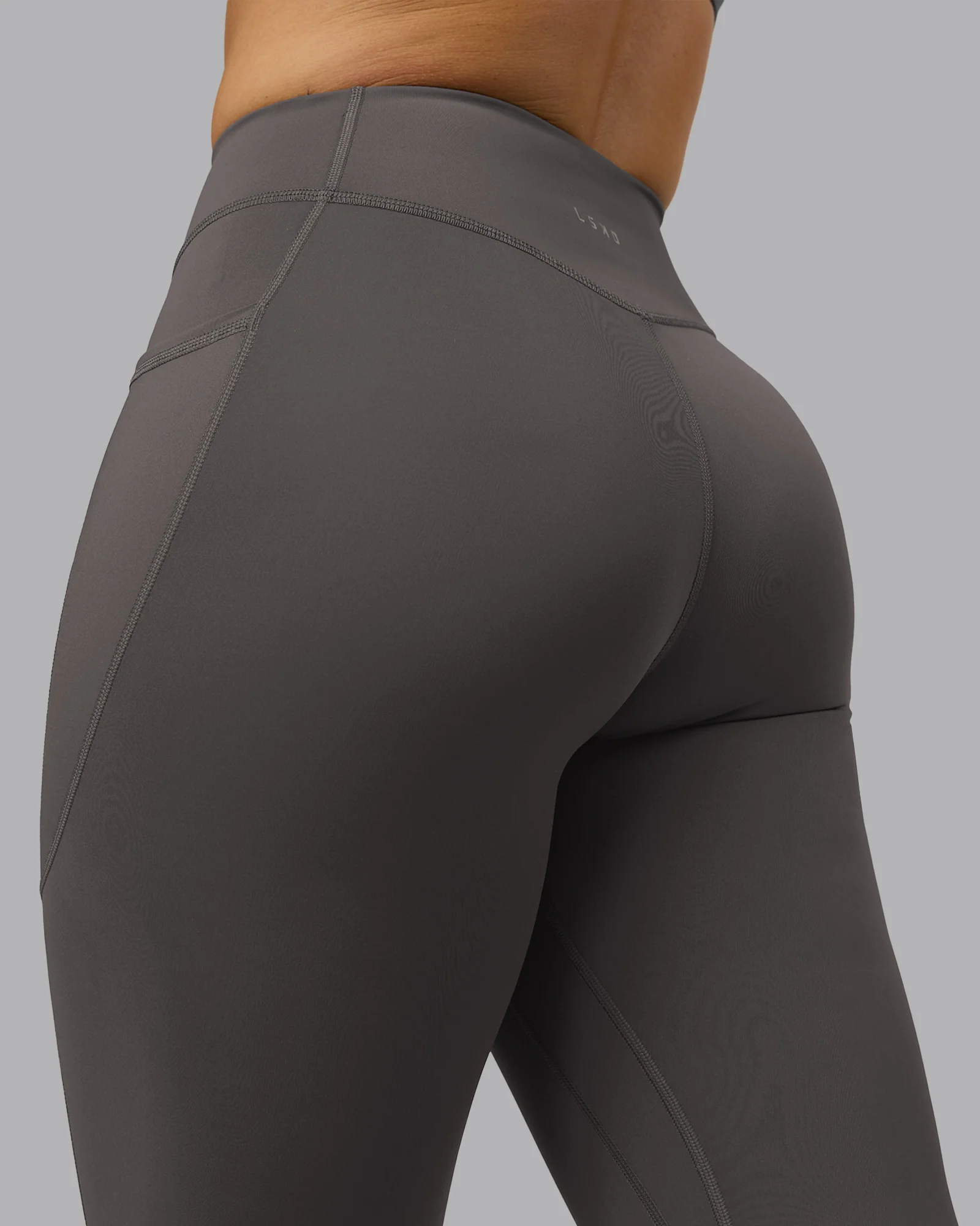 6206-elite-high-rise-7-8-legging-pockets-dark-storm-9.webp Elite High-Rise 7/8 Legging Pockets - Dark Storm